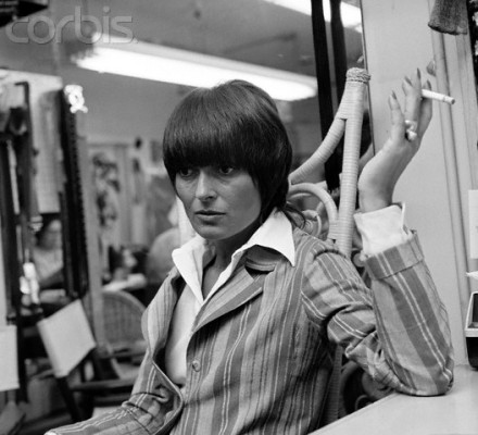 ca. June 22, 1971, New York City, New York, USA --- Fashion designer Liz Claiborne smoking in her work room. --- Image by © Condé Nast Archive/Corbis